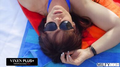 A stunning curvy MILF shows off her riding skills in the sun during an intense poolside session