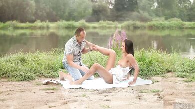 Sexy brunette Viktoria Sweet gives a deep blowjob outdoors in nature